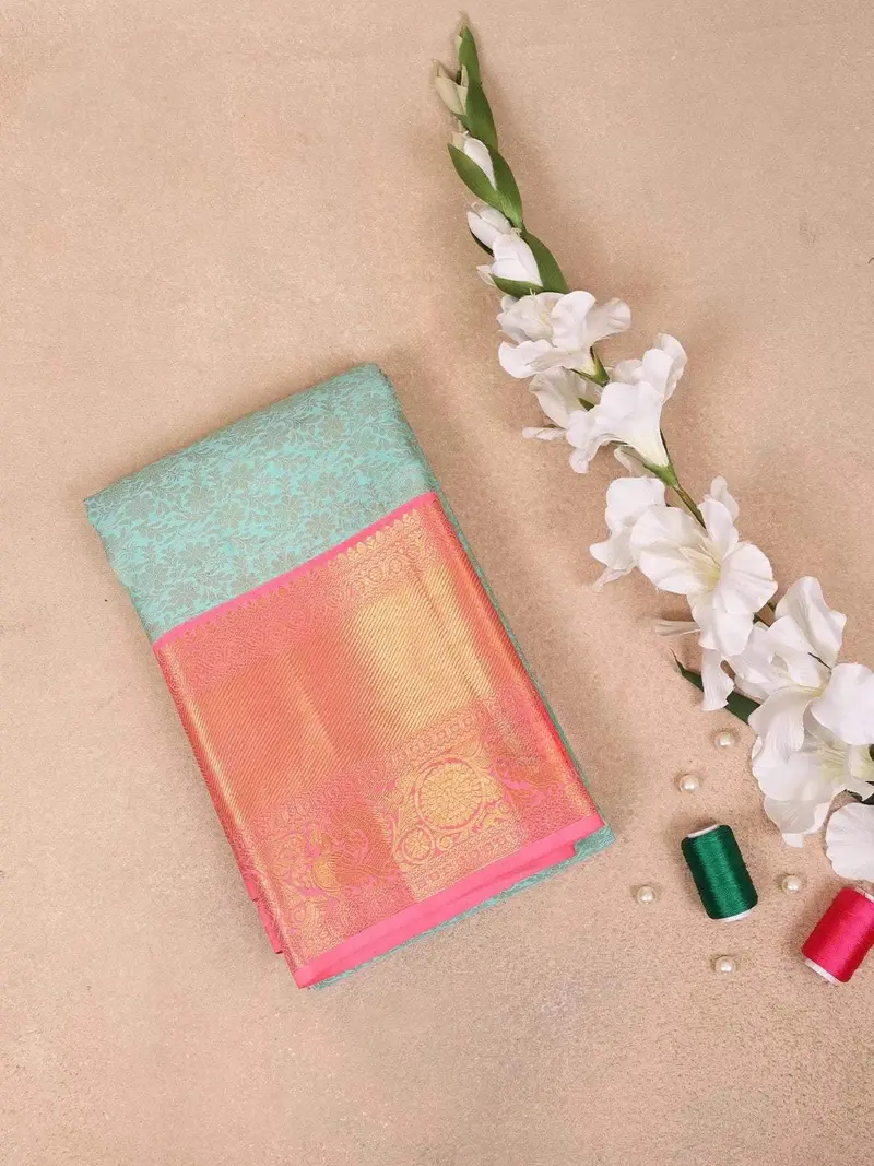 Aqua Blue Pure Kanchipuram Bridal Silk Saree With Flower Jacquard Design On The Body With Contrast Border 1