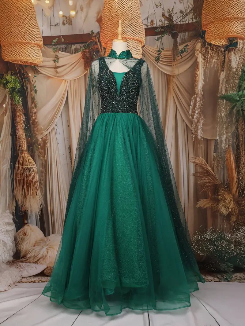 Emerald Green Sequins Embroidered Design Net Gown With Sheer Cape Sleeves 1