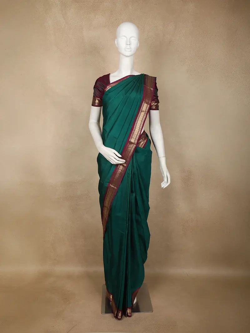 Emerald Green Solid Design Kanchipuram Silk Saree With Contrast Maroon Zari Border 1