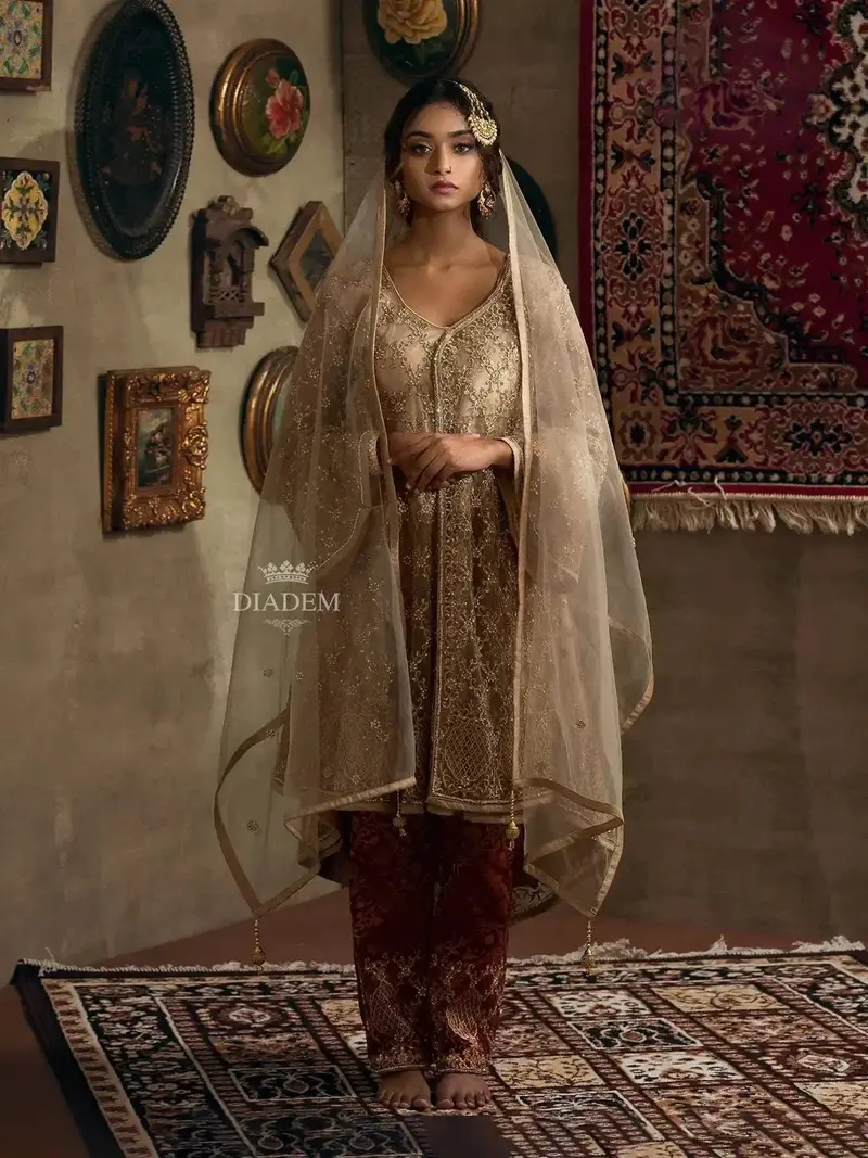 Gold-Net Straight Cut Salwar Suit With Stone Embellishments Along With Brocade Pants And Embroidered Net Dupatta 1