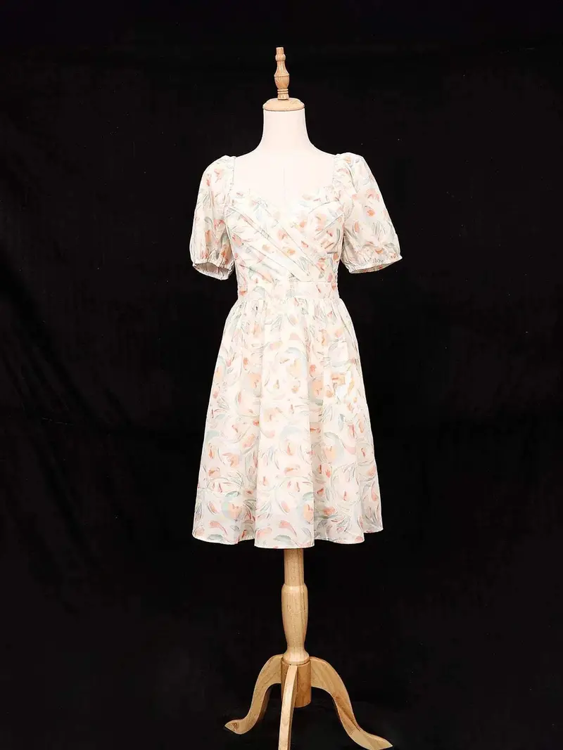 Ivory Frock Adorned With Floral And Ruffled Design 1