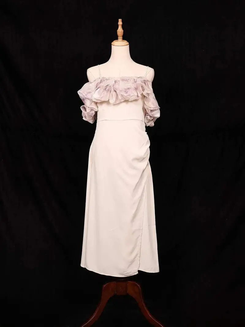 Ivory Frock Adorned With Plain And Ruffled Design 1