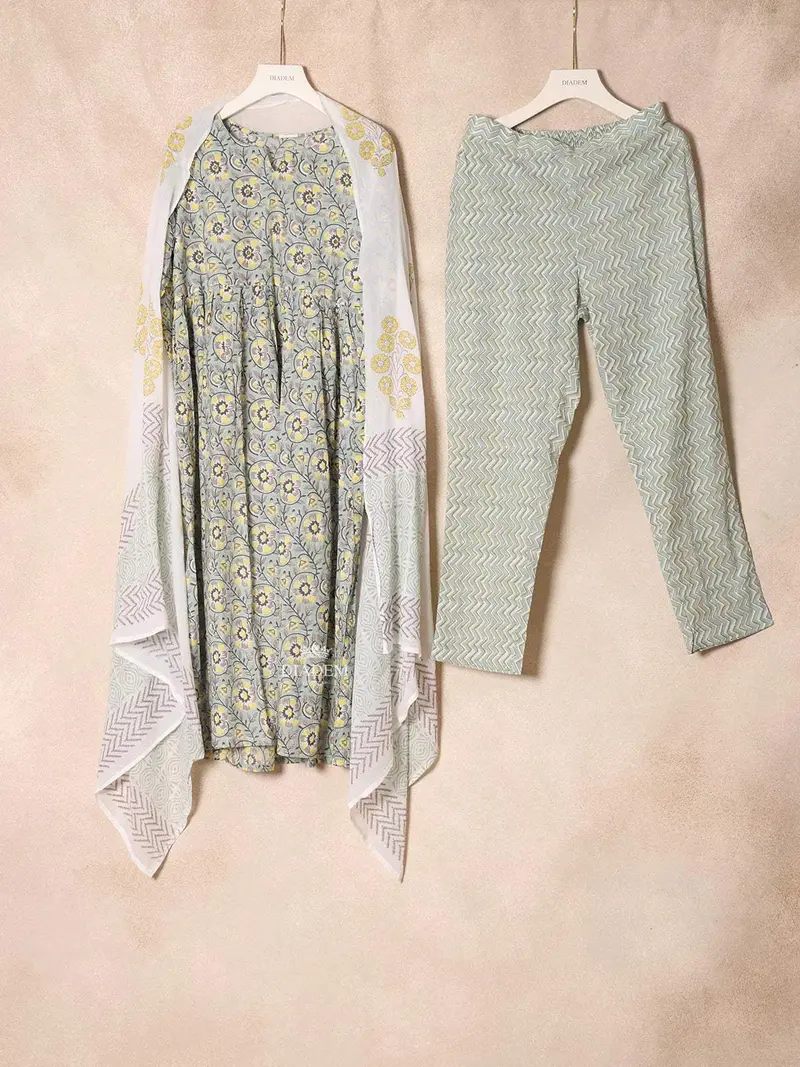 Light Green Cotton Straight Cut Salwar Suit For Girls Adorned With Floral Prints Paired With Dupatta 1