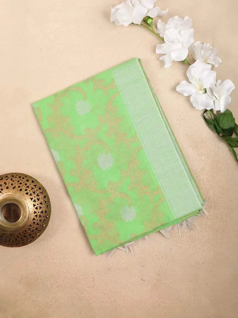 Light Green Silk Cotton Saree With Floral Design On The Body With Matching Border 1