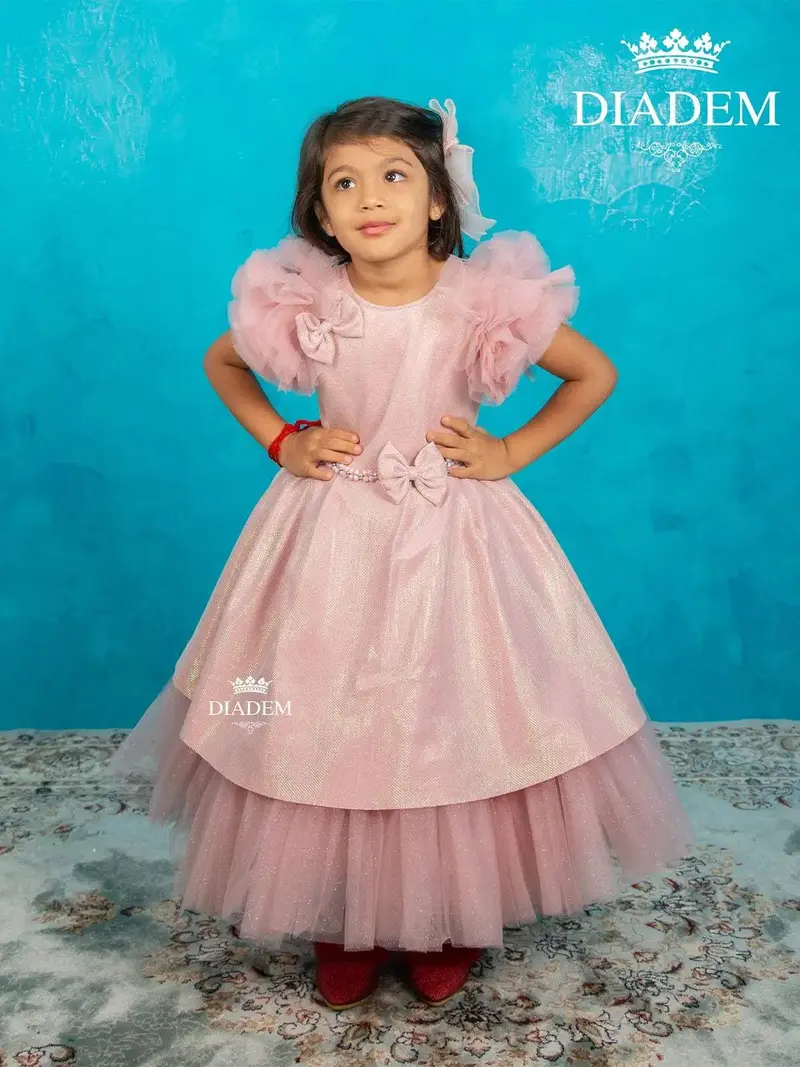 Light Pink Shimmer Net Ruffle Sleeve Gown With Attached Bow 1