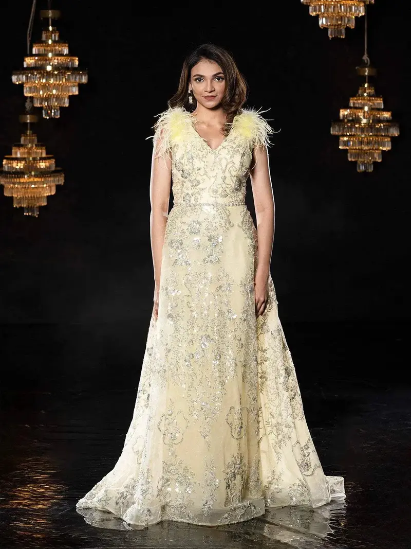 Light Yellow Net Gown With Sequins And Feathers 1