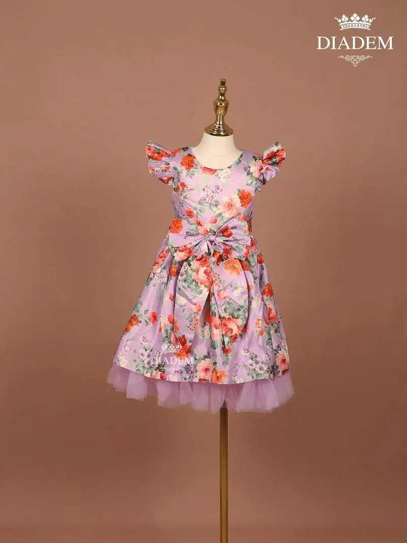 Lilac Satin Gown Adorned With Floral Prints And Attached Bow 1