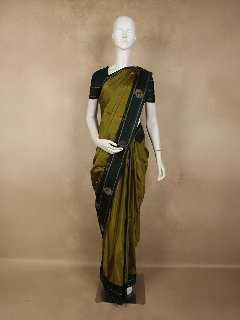 Olive Green Butta Woven Design Soft Silk Fancy Saree With Contrast Peacock Zari Border 1