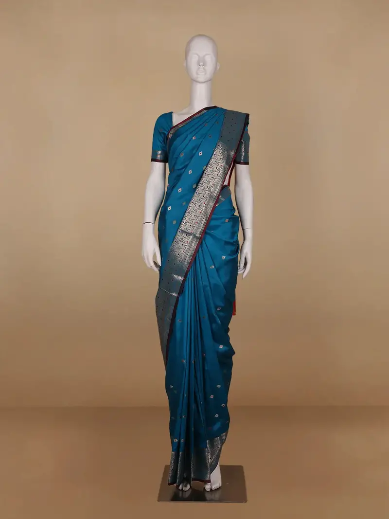 Peacock Blue Floral And Diamond Motifs Zari Weaving Soft Silk Saree 1