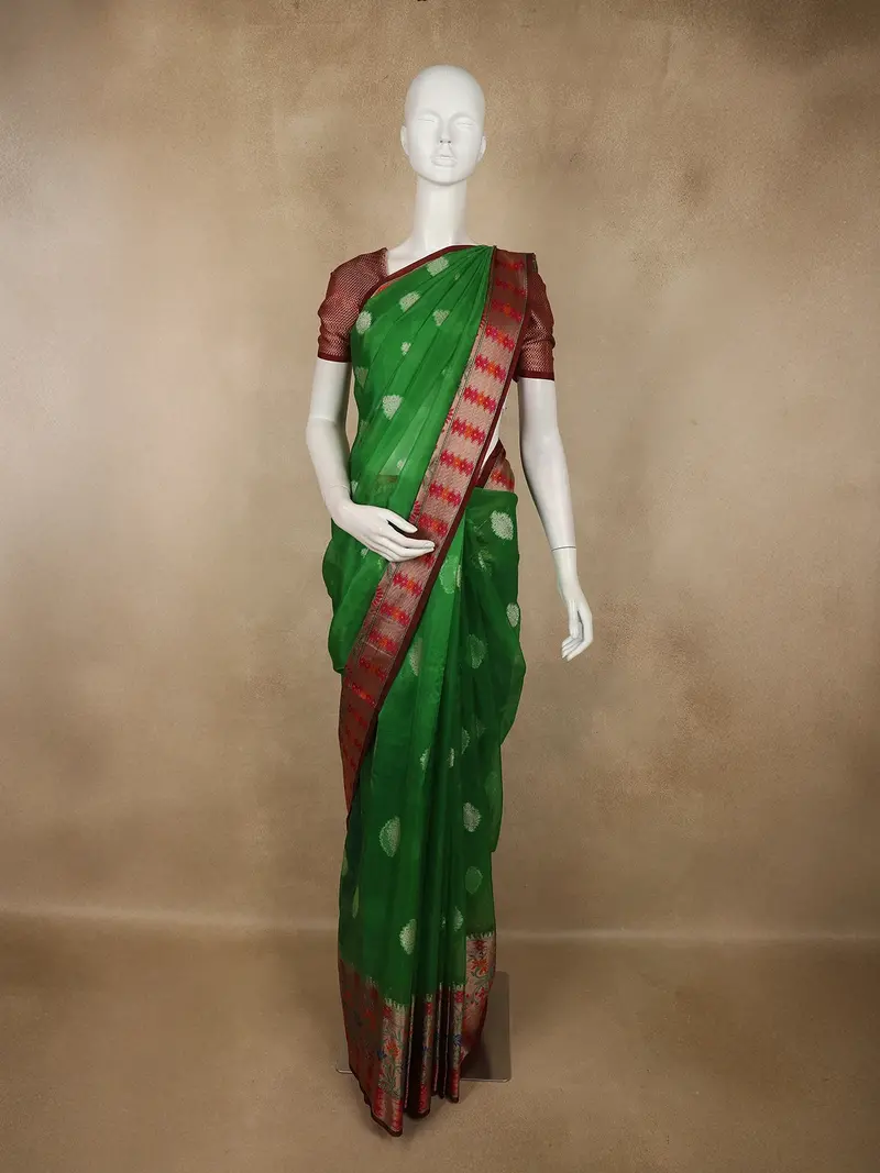 Rich Emerald Green Floral Butta Woven Design Tissue Silk Fancy Saree With Contrast Border 1