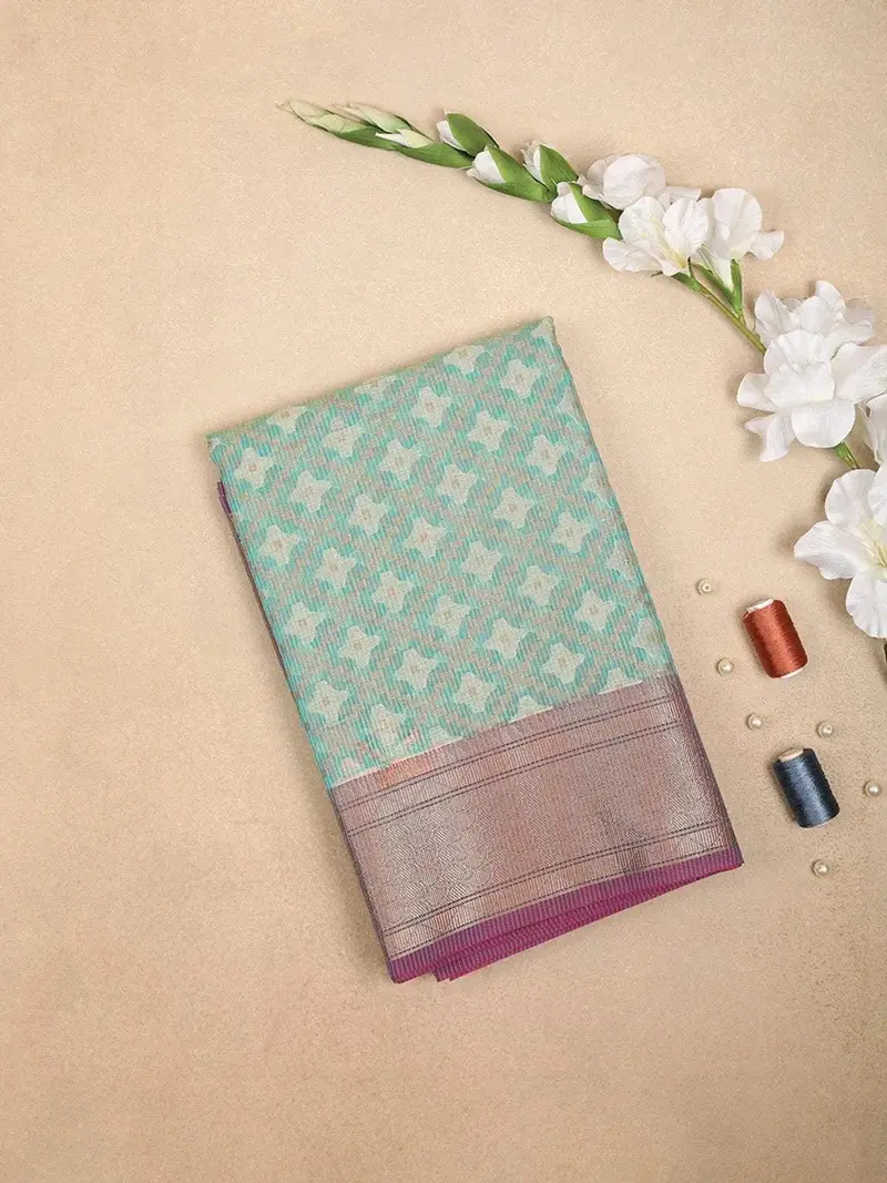 Teal Blue Art Silk Saree With Diagonal Floral Design On The Body With Zari Border 1