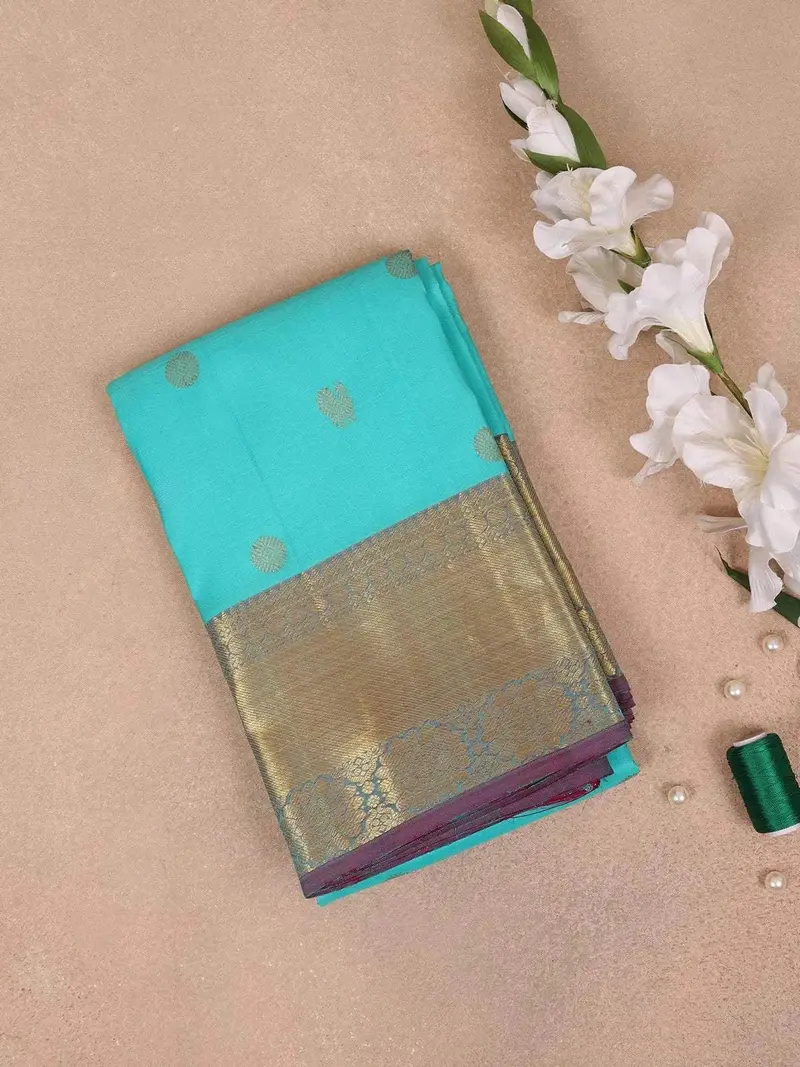 Turquoise Blue Pure Kanchipuram Bridal Silk Saree With Peacock And Chakra Motif Design With Zari Border 1