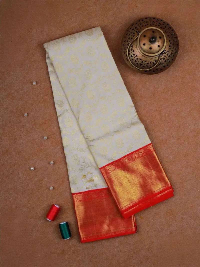 White Pure Kanchipuram Silk Saree With Vines Floral Design On The Body With Korvai Border 1
